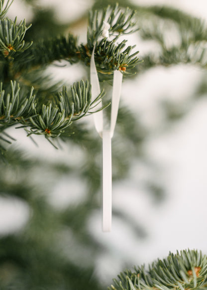 Christmas ornaments for coworkers from the side.