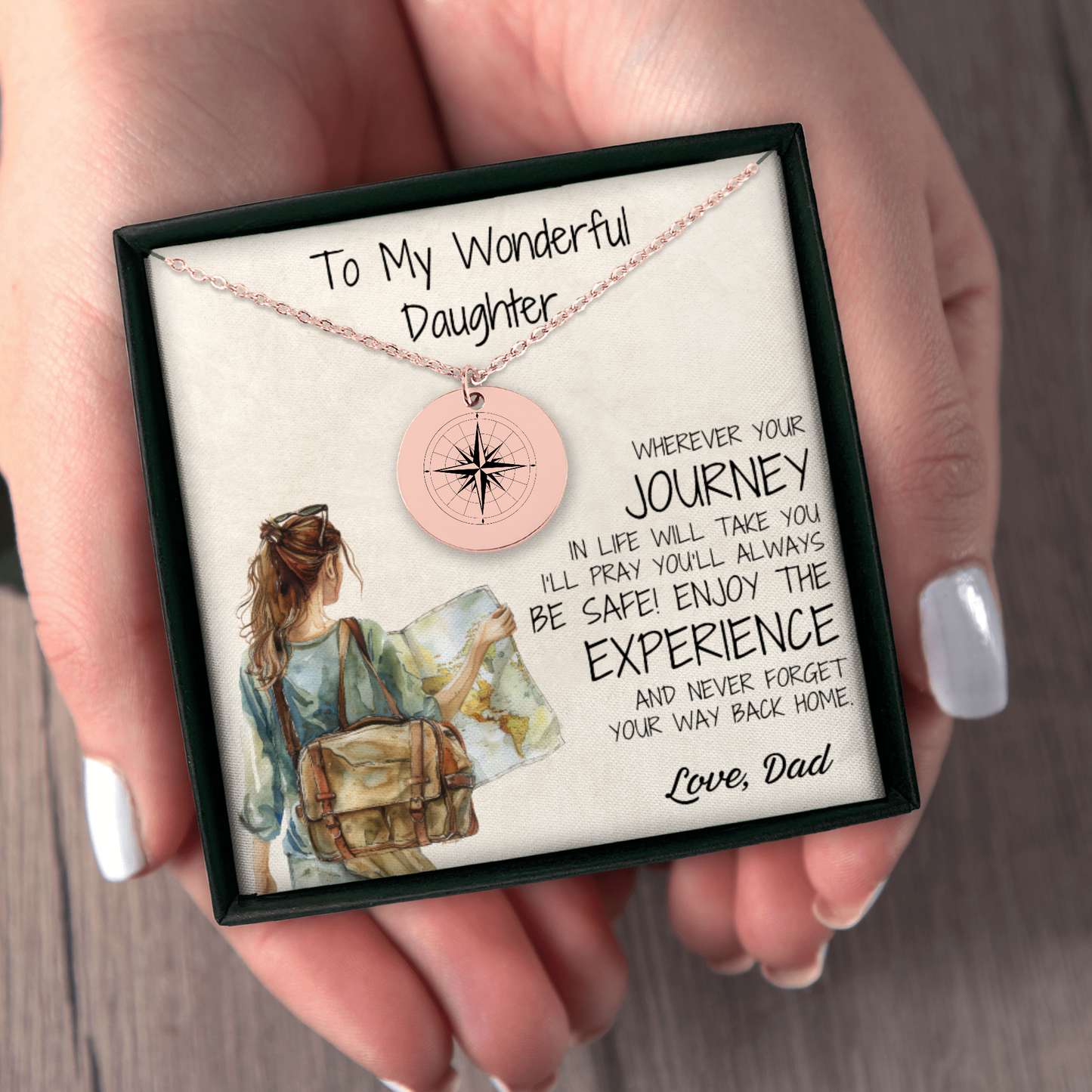 A rose gold compass necklace, engraved with love, perfect for your daughter. This thoughtful gift is ideal for graduations, long-distance connections, or just to remind her that "Adventure Awaits" in every step of her journey.