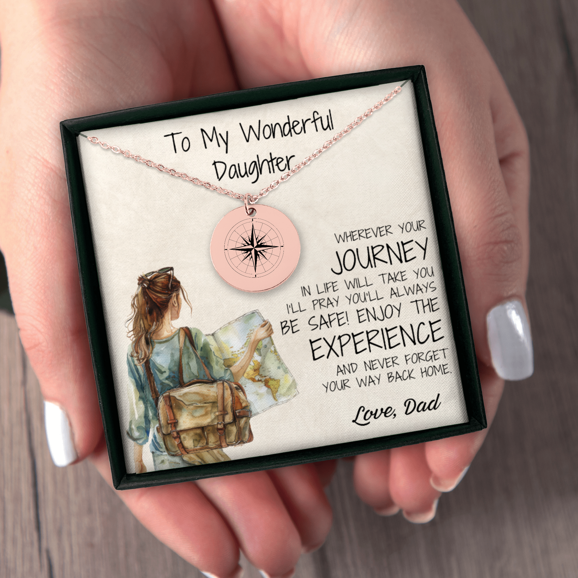 A rose gold compass necklace, engraved with love, perfect for your daughter. This thoughtful gift is ideal for graduations, long-distance connections, or just to remind her that "Adventure Awaits" in every step of her journey.