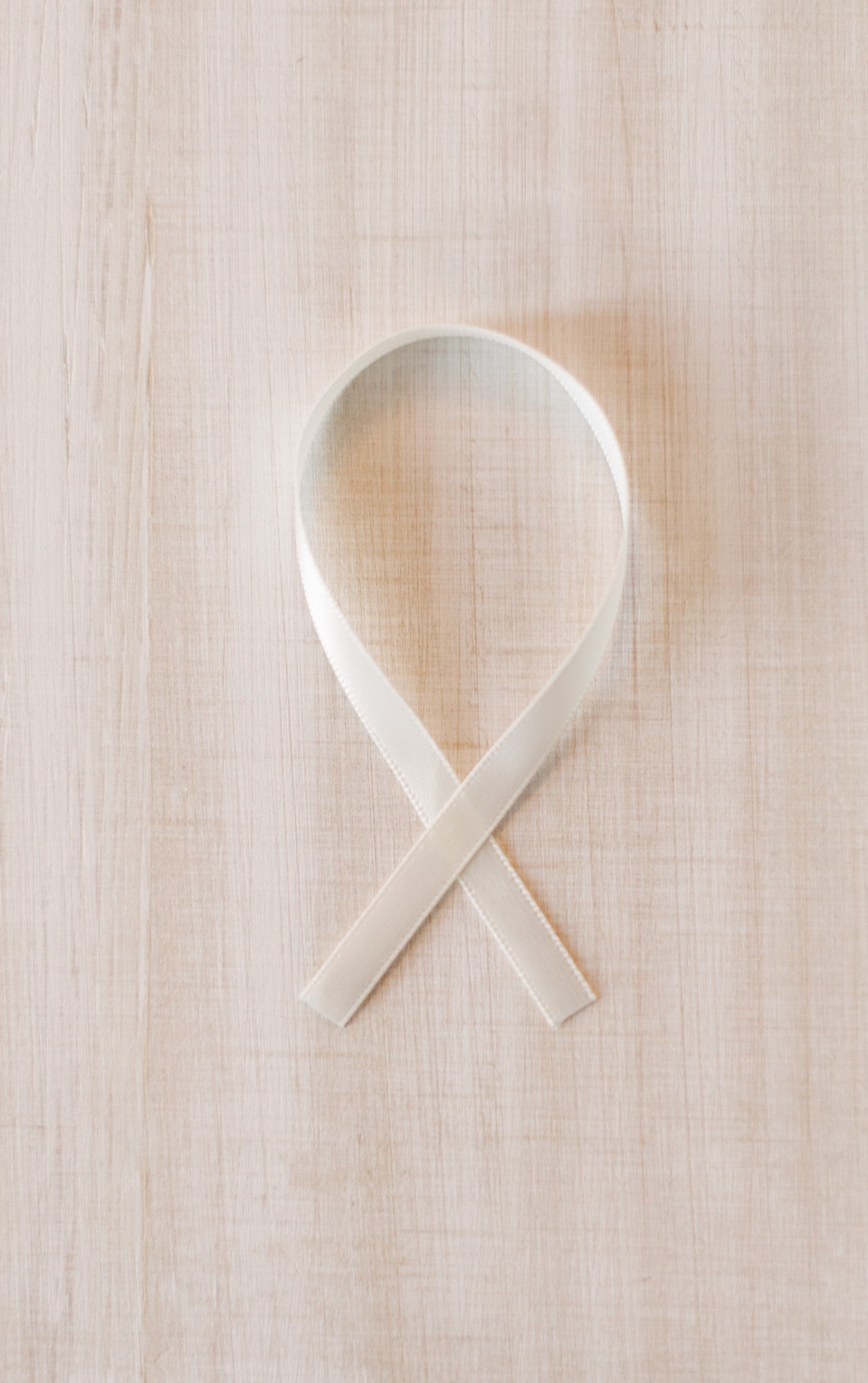 White ribbon which comes with the Christmas ornament.